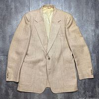 Full front view of cream/yellow blazer with pockets and button visible