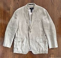 Front view of beige Alfani linen blazer laid flat showing overall condition