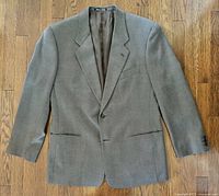Front view of taupe Giorgio Armani Mani blazer showing buttons, lapels and pockets