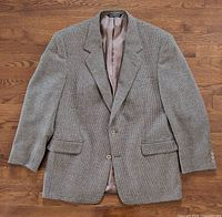 Front view of blazer showing pattern, lapel, button stance, pockets
