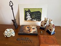All nine cat-themed items displayed on tabletop