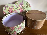 Group shot showing all three hat boxes with lids off highlighting interiors and exteriors