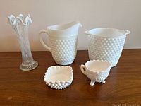 Group shot of all five pieces on wooden surface