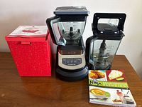 Blender base, two pitchers, recipe book, boxed egg cooker