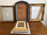 Front view showing three larger frames and four stacked smaller frames