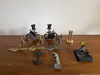 All nine metal pieces arranged on table