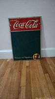 Front view showing entire Coca-Cola chalkboard sign