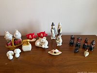 Overview of all ceramic and cast iron shaker sets on table