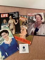 All four magazines laid out showing covers