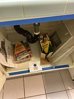 Cabinet view showing sketch pad, Crayola markers, colored pencil box and canvases