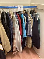 Clothing rack showing entire assortment of jackets, shirts, sweatshirts and pants