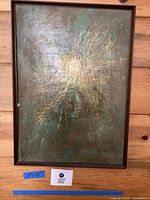 Full view of framed painting with spark-like burst, measurement label visible