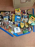 Overview of lot showing all supplies and grabber tools spread on floor