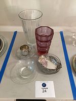 Group shot showing both vases, silver cup, sterling dish, glass bowl and plate