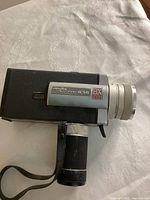 Left side profile of Minolta Autopak-8 S6 showing model plate and grip