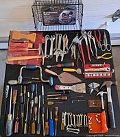 overall layout of all hand tools, unopened toolkit visible