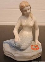 Front view of porcelain mermaid figurine