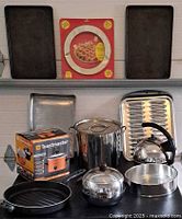 All items grouped: Penguin server, stock pot, kettle, boxed slow cooker, broiler pan, baking sheets