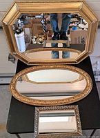 Three mirrors displayed together showing sizes and frames