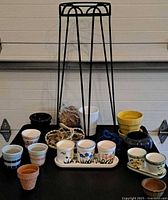 Group shot of all pots, metal stand, macramé hangers