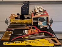 Group shot of all saws, mitre box, spare blades