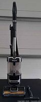 Full view of Shark UV725 upright vacuum and brush attachment