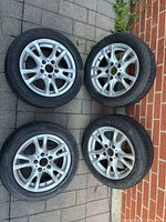 All four rims and tires laid out