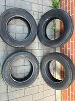 All four Goodyear 205/65R15 tires displayed side by side