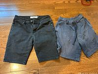 Both pairs of shorts laid flat on floor