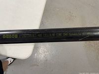 Full view of black 2-inch schedule 40 pipe on table showing printed specifications