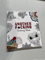 Front cover of paperback adult colouring book