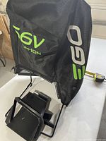 Overall view of grass bag showing 56V and EGO logos, frame, and chute piece