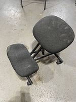 Top view of charcoal grey ergonomic kneeling chair showing seat, knee pad and metal frame