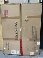 Sealed cartons showing KEONI INN branding and BATHROOM LED MIRROR text