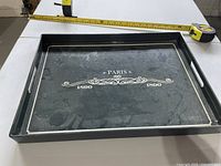 Top view of rectangular serving tray with tape measure showing size