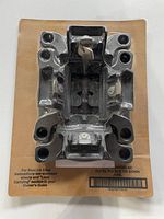 Front view of packaged BoxLink tie-down cleat showing part number and sealed condition