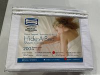 Packaged Simmons Hide-A-Bed queen sheet set front view