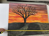 Front view of entire painting with tape measure showing width