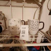 both mugs front view on shelf