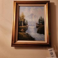 Full view of framed landscape painting
