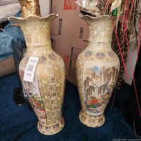 Two Satsuma-style vases showing full height and patterns
