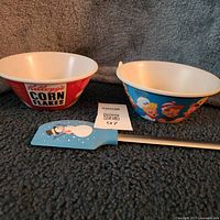 Overview of two Kellogg's bowls and snowman spatula