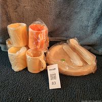 group shot of mugs, plates and bagged cutlery