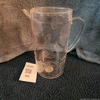 Full view of clear plastic seascape pitcher with lid