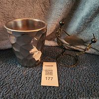 Both items side by side: silver planter, beaded metal candleholder