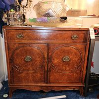 Full front view of burl walnut sideboard cabinet showing overall design