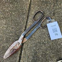 Full view of Wiss tin snips on ground