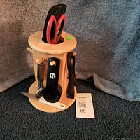 Overall view of wooden utensil holder with included utensils