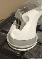 Grab bar latch and suction pad edge