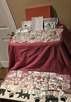 Overall view of shoebox contents with many plastic bags of sorted stamps and country list sheet